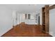 Living room with hardwood floors and kitchen view at 513 N Graham St # 1B, Charlotte, NC 28202