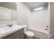 Clean bathroom with single sink, tub, and window at 607 Stewart Ct, Statesville, NC 28677