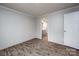 Bright bedroom with wood-look floors and access to bathroom at 607 Stewart Ct, Statesville, NC 28677