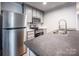 Modern kitchen with stainless steel appliances at 607 Stewart Ct, Statesville, NC 28677