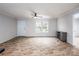 Living room with wood-look floors and ceiling fan at 607 Stewart Ct, Statesville, NC 28677