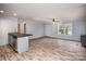 Open concept living area with wood floors at 607 Stewart Ct, Statesville, NC 28677
