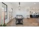 Bright dining area with long wooden table, adjacent to kitchen at 7016 Olive Branch Rd, Marshville, NC 28103