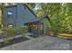 Green house exterior with shed and landscaping at 7024 Pleasant Dr, Charlotte, NC 28211