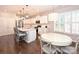 Modern kitchen with island, white cabinets, and stainless steel appliances at 7027 Walnut Branch Ln, Charlotte, NC 28277