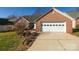 Front view of brick home with a two-car garage at 730 Hidden Creek Cir, Salisbury, NC 28147