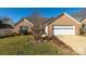 Brick ranch home with attached garage and landscaped lawn at 730 Hidden Creek Cir, Salisbury, NC 28147
