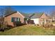 Brick home with green shutters and a well-maintained lawn at 730 Hidden Creek Cir, Salisbury, NC 28147