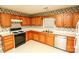 Kitchen with wood cabinets, gas range and dishwasher at 730 Hidden Creek Cir, Salisbury, NC 28147