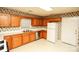 Kitchen boasts wood cabinets, a double sink and white appliances at 730 Hidden Creek Cir, Salisbury, NC 28147