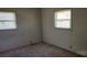Simple bedroom with carpet and two windows at 835 Maple Ave, Salisbury, NC 28144