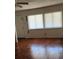 Living room with hardwood floors and two windows at 835 Maple Ave, Salisbury, NC 28144