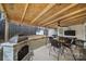 Covered back deck with fireplace, grill, and seating at 1055 Cedar Hills Ln, Lancaster, SC 29720