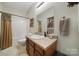 Small bathroom with tub, toilet, and vanity at 1055 Cedar Hills Ln, Lancaster, SC 29720
