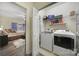 Convenient laundry room with washer, dryer, and shelving at 1055 Cedar Hills Ln, Lancaster, SC 29720