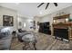 Living room with hardwood floors, fireplace, and large TV at 1055 Cedar Hills Ln, Lancaster, SC 29720