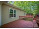 Spacious back deck with stained wood and views of the lush, green backyard at 1313 Western Hills Ln, Vale, NC 28168