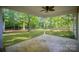 A covered back porch featuring fan and wooded view at 1313 Western Hills Ln, Vale, NC 28168