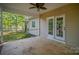 A covered back porch with access to a well-maintained yard and home access at 1313 Western Hills Ln, Vale, NC 28168