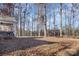 Wooded backyard with a large open area at 1313 Western Hills Ln, Vale, NC 28168