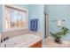 Relaxing bathroom featuring a jetted tub and a walk-in shower at 1313 Western Hills Ln, Vale, NC 28168