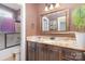 Bathroom with granite countertop, single sink, and dark brown cabinets at 1313 Western Hills Ln, Vale, NC 28168