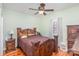 Spacious bedroom with wooden furniture and a ceiling fan at 1313 Western Hills Ln, Vale, NC 28168