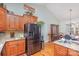 Kitchen with wood cabinets and stainless steel appliances at 1313 Western Hills Ln, Vale, NC 28168