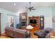 Living room with stone fireplace and hardwood floors at 1313 Western Hills Ln, Vale, NC 28168