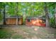 Two stained wooden sheds stand ready to store all your tools and toys at 1313 Western Hills Ln, Vale, NC 28168