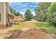 Expansive backyard showcasing a house, a deck, and an detached garage/shed at 1323 Christopher Cir, Rock Hill, SC 29730