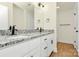 Bathroom featuring granite countertops, double sinks, modern fixtures, and white cabinets at 1323 Christopher Cir, Rock Hill, SC 29730