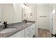 Bathroom featuring double sinks with granite counters and modern black fixtures at 1323 Christopher Cir, Rock Hill, SC 29730