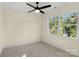 Well-lit bedroom featuring a ceiling fan and a large window at 1323 Christopher Cir, Rock Hill, SC 29730
