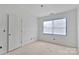 Bright bedroom featuring a window and a door, ready to be customized at 1323 Christopher Cir, Rock Hill, SC 29730