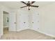 Spacious bedroom with neutral carpet, ceiling fan, closet, and easy access to the ensuite bathroom at 1323 Christopher Cir, Rock Hill, SC 29730