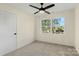 Cozy bedroom with a ceiling fan and large window providing ample natural light at 1323 Christopher Cir, Rock Hill, SC 29730