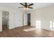 Spacious bedroom showcasing new flooring, neutral walls, and two entry doors at 1323 Christopher Cir, Rock Hill, SC 29730