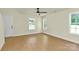 Inviting bedroom with wood floors and natural light from large windows at 1323 Christopher Cir, Rock Hill, SC 29730