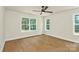 Bedroom showcasing natural lighting from windows and a modern ceiling fan at 1323 Christopher Cir, Rock Hill, SC 29730