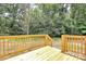 Newly constructed wooden deck, including painted railing and steps leading to the backyard at 1323 Christopher Cir, Rock Hill, SC 29730