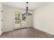 Dining area featuring wood floors and a door leading to the outdoor deck at 1323 Christopher Cir, Rock Hill, SC 29730