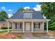 Charming single-Gathering home with covered porch, neutral siding, and black shutters, ready for a new Gathering at 1323 Christopher Cir, Rock Hill, SC 29730
