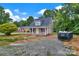 Attractive home featuring classic siding, inviting front porch, and dormer window in a serene, tree-lined setting at 1323 Christopher Cir, Rock Hill, SC 29730