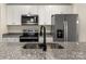 Well-equipped kitchen featuring granite countertops, stainless steel appliances, and white cabinets at 1323 Christopher Cir, Rock Hill, SC 29730