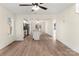 Open living space with wood floors flowing into kitchen with stainless steel appliances at 1323 Christopher Cir, Rock Hill, SC 29730
