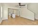 A well lit open living space with hardwood floors and stairs to the upper level at 1323 Christopher Cir, Rock Hill, SC 29730