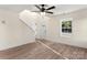 Bright, neutral living room showcasing wood floors, a ceiling fan, and natural light at 1323 Christopher Cir, Rock Hill, SC 29730
