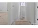 Staircase with a door straight ahead and natural light from a window to the right at 1323 Christopher Cir, Rock Hill, SC 29730