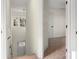 Bright stairwell featuring neutral walls, carpeted steps, and modern light fixture at 1323 Christopher Cir, Rock Hill, SC 29730